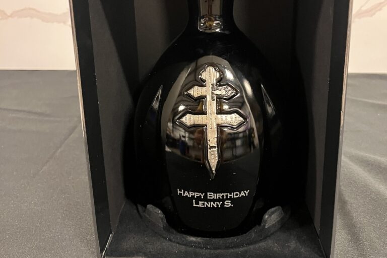 Engraved D'Usse cognac bottle with a personalized birthday message in a black gift box